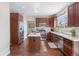 Bright kitchen with a center island, stainless steel appliances, and hardwood floors at 9810 Townsville Cir, Highlands Ranch, CO 80130