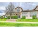 Back exterior of home with lawn, greenery, and an entrance sliding door at 23070 York Ave, Parker, CO 80138