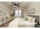 Bedroom featuring a bed, and a black side table with decorations at 23070 York Ave, Parker, CO 80138