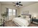 Primary bedroom with lots of natural light, a ceiling fan, and neutral furnishings at 23070 York Ave, Parker, CO 80138