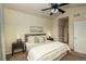 Comfortable bedroom with a ceiling fan, neutral tones, and plush carpeting at 23070 York Ave, Parker, CO 80138