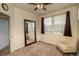 Bright bedroom featuring neutral decor, a ceiling fan, carpeted floors, and two large windows at 23070 York Ave, Parker, CO 80138