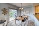 Cozy dining area features a sliding glass door to the patio and stylish decor at 23070 York Ave, Parker, CO 80138