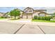 Front exterior of home with lawns, garden and a 2-car garage at 23070 York Ave, Parker, CO 80138