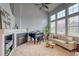 Spacious living room boasts soaring ceilings, large windows, a fireplace, and comfortable seating at 23070 York Ave, Parker, CO 80138