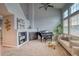 Spacious living room featuring a fireplace, large windows, and ample natural light at 23070 York Ave, Parker, CO 80138