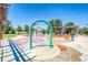 Exterior shot of community splash pad with various colorful water features for play at 23070 York Ave, Parker, CO 80138