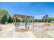 Community splash pad with a pergola, picnic tables, and friendly water features at 23070 York Ave, Parker, CO 80138