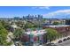 Scenic cityscape view featuring the historic building in the foreground and downtown skyline in the background at 2944 Zuni St # B, Denver, CO 80211