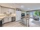 Bright living room with modern kitchen, stainless steel appliances, and an open floorplan at 2944 Zuni St # B, Denver, CO 80211