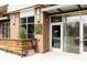Brick building with a glass-enclosed entrance and a small bench at Lady Jane restaurant, street view at 3233 Tejon St # 103, Denver, CO 80211