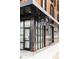 Modern building with large windows and a stylish 'GH' sign in black and white on a corner location at 3233 Tejon St # 103, Denver, CO 80211