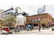 A lively outdoor scene featuring the iconic Little Personal Ice Cream shop with its unique milk can design at 3233 Tejon St # 103, Denver, CO 80211