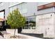 Modern building with large windows and signage for Little Owl, with landscaping and street access at 3233 Tejon St # 103, Denver, CO 80211
