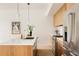 Kitchen counter with stainless steel sink, modern faucet, and designer pendant lights at 3233 Tejon St # 103, Denver, CO 80211