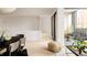 Open-concept living space with modern furnishings and seamless access to an outdoor balcony at 3233 Tejon St # 103, Denver, CO 80211