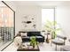Bright living room featuring modern artwork, comfortable seating, and stylish decor at 3233 Tejon St # 103, Denver, CO 80211