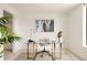 Bright office space with a modern glass desk, gold accents, and neutral decor for a productive workspace at 3233 Tejon St # 103, Denver, CO 80211
