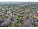 Aerial view of a charming neighborhood with mature trees and a scenic pond at 2800 S University Blvd # 170, Denver, CO 80210