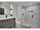 Bathroom with a glass walk-in shower and modern vanity with a large mirror at 2800 S University Blvd # 170, Denver, CO 80210