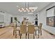 Dining area showcasing contemporary lighting, fireplace, and open-concept design at 2800 S University Blvd # 170, Denver, CO 80210