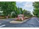Community entrance with lush landscaping, flowers, and clear signage for Cherry Hills III at 2800 S University Blvd # 170, Denver, CO 80210