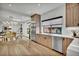 Contemporary kitchen showcases wood cabinets, stainless steel appliances, and adjacent dining area at 2800 S University Blvd # 170, Denver, CO 80210