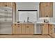 Modern kitchen features wood cabinets, stainless steel appliances, and sleek countertops at 2800 S University Blvd # 170, Denver, CO 80210