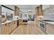 Modern kitchen features light wood cabinets, stainless steel appliances, and bright countertops at 2800 S University Blvd # 170, Denver, CO 80210