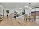 Open living and dining area with a fireplace and modern furnishings at 2800 S University Blvd # 170, Denver, CO 80210