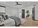 Bright main bedroom with a ceiling fan, sitting area, and wooden floors at 2800 S University Blvd # 170, Denver, CO 80210