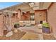 Charming outdoor patio with brick pillars, comfortable seating, and a stylish rug for relaxing at 2800 S University Blvd # 170, Denver, CO 80210