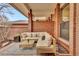 Charming outdoor patio with brick pillars, comfortable seating, and a stylish rug for relaxing at 2800 S University Blvd # 170, Denver, CO 80210