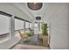 Inviting sunroom with wicker seating, decorative lighting, and a view to the outdoors at 2800 S University Blvd # 170, Denver, CO 80210
