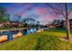 Beautiful water view at dusk with lovely landscaping and reflection of the buildings, trees and sunset at 2800 S University Blvd # 170, Denver, CO 80210