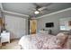 Cozy bedroom with soft gray walls, white trim and a ceiling fan for comfort at 10824 Quail Ridge Dr, Parker, CO 80138
