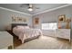 Cozy bedroom with soft gray walls, complementary artwork, and natural light from the window at 10824 Quail Ridge Dr, Parker, CO 80138