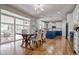 Bright dining area featuring stylish furniture, access to the backyard, and kitchen views at 10824 Quail Ridge Dr, Parker, CO 80138