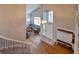 Open foyer with hardwood floors, views to a bright living room, and convenient coat rack at 10824 Quail Ridge Dr, Parker, CO 80138