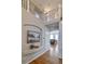 Elegant foyer featuring hardwood floors, an open staircase, and a serene art piece at 10824 Quail Ridge Dr, Parker, CO 80138