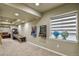 Entertaining game room area featuring classic arcade games and window views at 10824 Quail Ridge Dr, Parker, CO 80138