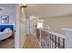 Hallway with staircase and bedroom access, creating a seamless flow at 10824 Quail Ridge Dr, Parker, CO 80138