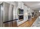 Spacious kitchen showcasing stainless steel appliances, double ovens, and a beverage cooler at 10824 Quail Ridge Dr, Parker, CO 80138