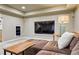 Comfortable living room featuring a large screen television and cozy seating area at 10824 Quail Ridge Dr, Parker, CO 80138