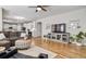Spacious living room with hardwood floors and an open layout to the kitchen at 10824 Quail Ridge Dr, Parker, CO 80138
