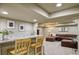 Open-concept space featuring a bar area, plush seating, and ample room for entertaining at 10824 Quail Ridge Dr, Parker, CO 80138