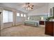 Large main bedroom boasts neutral decor, a vaulted ceiling, and plenty of natural light at 10824 Quail Ridge Dr, Parker, CO 80138