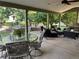 Covered patio with comfortable seating, tables, ceiling fan, and backyard views at 10824 Quail Ridge Dr, Parker, CO 80138