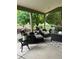 Spacious covered patio featuring comfortable seating areas and serene outdoor views at 10824 Quail Ridge Dr, Parker, CO 80138