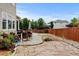 Outdoor living space featuring an expansive patio area, lush landscaping, and plenty of seating at 282 Vialpando St, Brighton, CO 80601